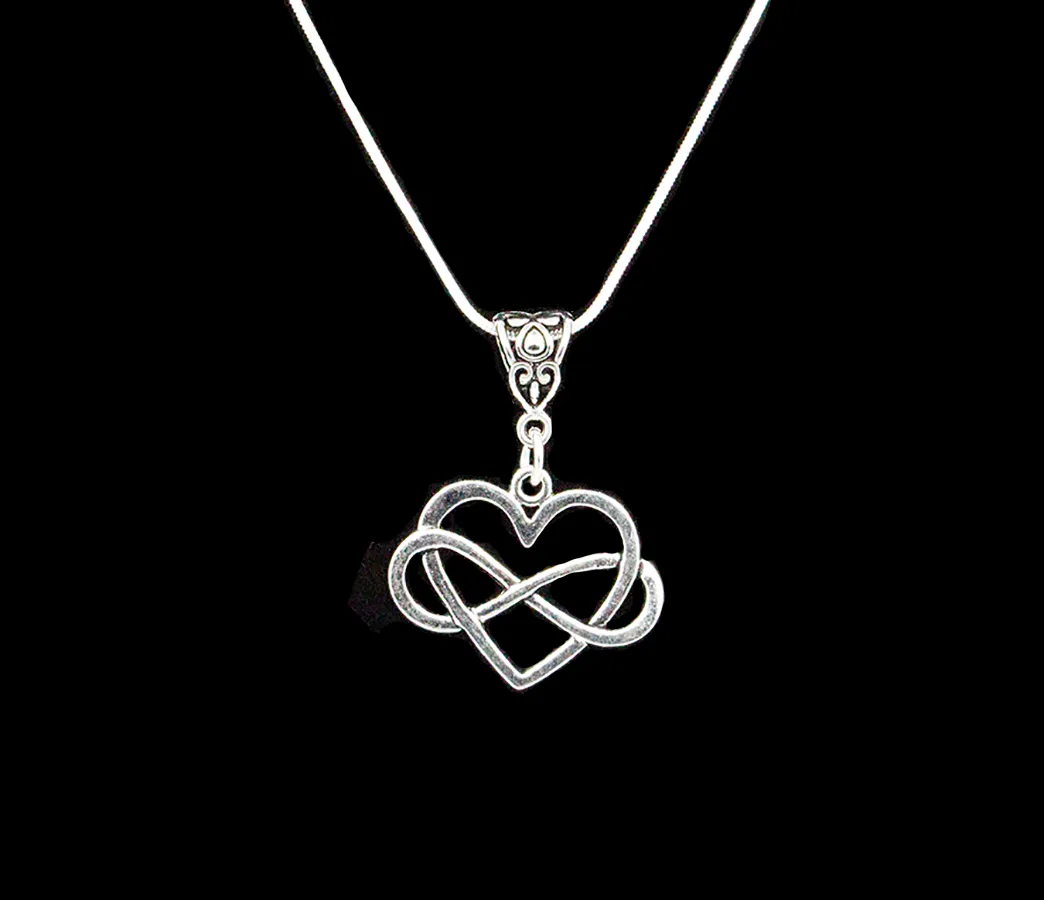 Heart with Infinity Symbol hung on a Stainless Steel Chain or braided Black Cord Necklace Pendant