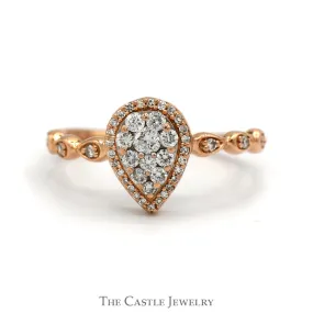 Pear Shaped Diamond Halo Cluster Ring With .25 CTTW Round Diamonds In 10KT Rose Gold